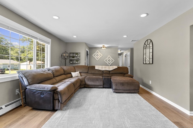 24 Pine Tree Rdg, Meriden, CT 06450 - living area with a baseboard heating unit, light wood-type flooring, and recessed lighting