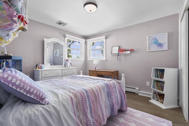 24 Pine Tree Rdg, Meriden, CT 06450 - bedroom with wood finished floors and a baseboard heating unit