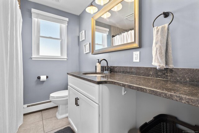 24 Pine Tree Rdg, Meriden, CT 06450 - bathroom with a baseboard heating unit, vanity, and tile patterned flooring
