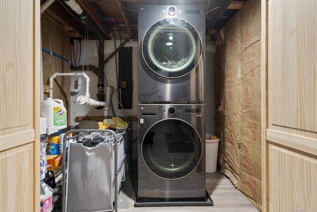 24 Pine Tree Rdg, Meriden, CT 06450 - washroom with stacked washer and clothes dryer and wood finished floors