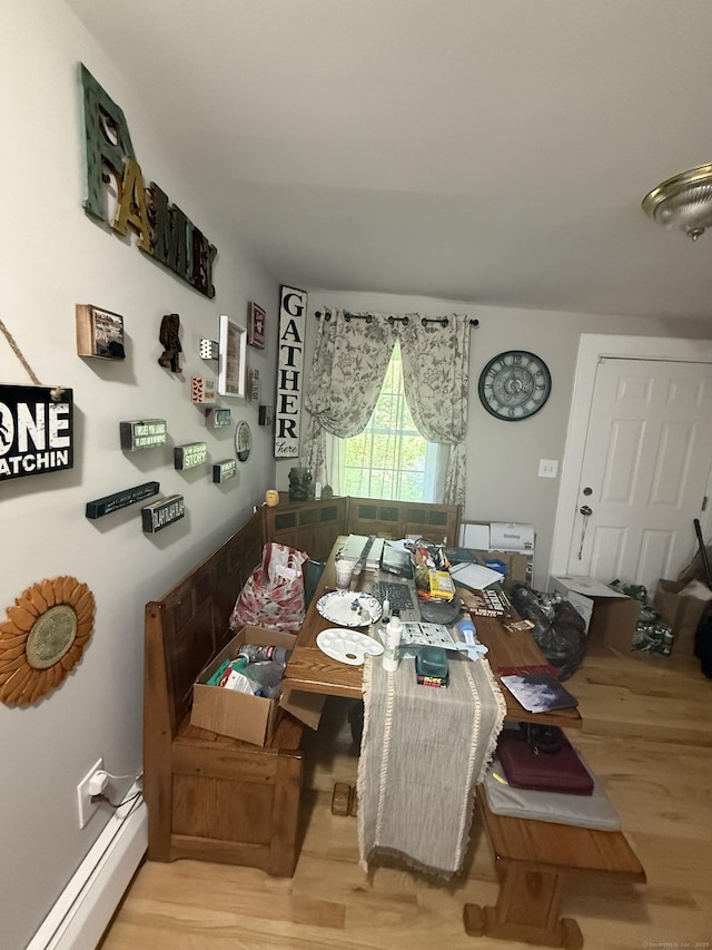 72 School St, Norwich, CT 06360 - dining area with wood finished floors and baseboard heating