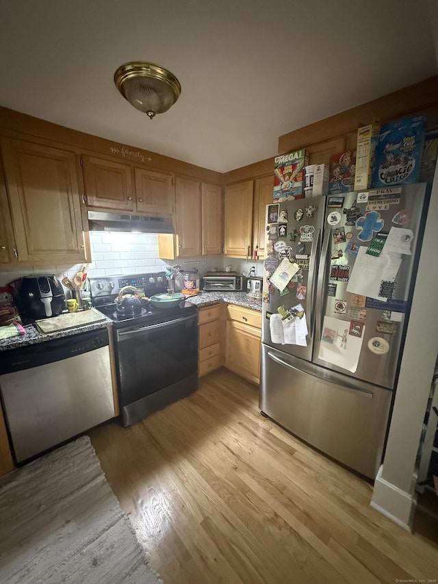 72 School St, Norwich, CT 06360 - kitchen with appliances with stainless steel finishes, under cabinet range hood, light wood-type flooring, and light countertops