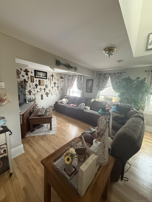 72 School St, Norwich, CT 06360 - living area featuring plenty of natural light and light wood-style flooring