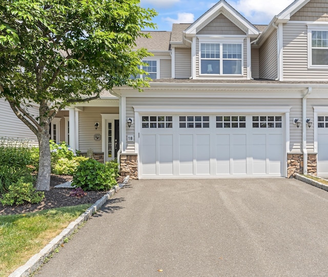 18 Briar Ridge Dr Unit 18, Bethel, CT 06801 - townhome / multi-family property featuring driveway, stone siding, and a shingled roof