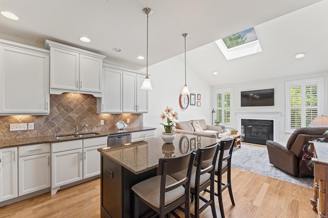 18 Briar Ridge Dr Unit 18, Bethel, CT 06801 - kitchen featuring a skylight, open floor plan, light wood finished floors, stainless steel dishwasher, and recessed lighting