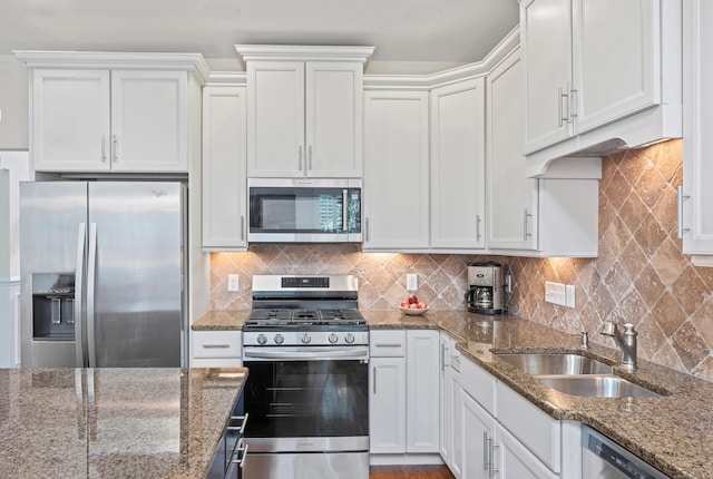 18 Briar Ridge Dr Unit 18, Bethel, CT 06801 - kitchen with stainless steel appliances, white cabinetry, stone counters, and decorative backsplash