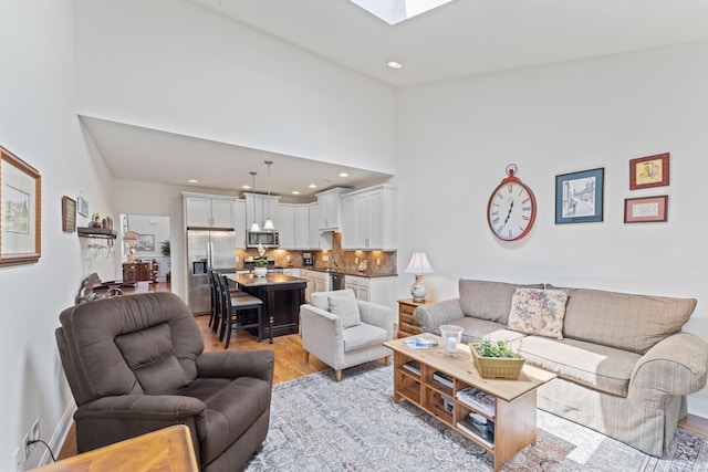 18 Briar Ridge Dr Unit 18, Bethel, CT 06801 - living room with a towering ceiling, light wood-type flooring, recessed lighting, and a skylight