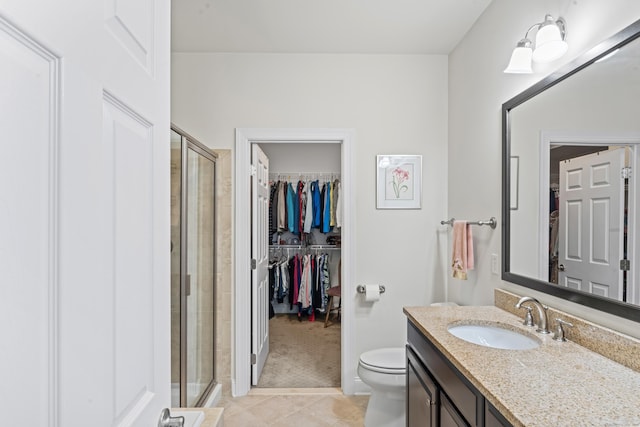 18 Briar Ridge Dr Unit 18, Bethel, CT 06801 - full bath featuring vanity, a shower stall, a walk in closet, and tile patterned floors