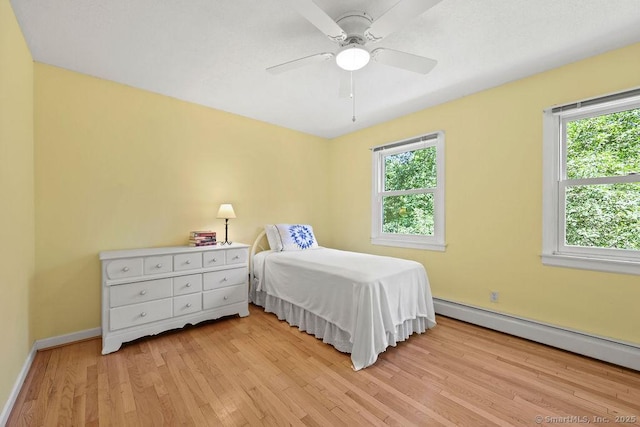 267 Jagger Ln, Hebron, CT 06248 - bedroom featuring light wood-type flooring, baseboard heating, and ceiling fan