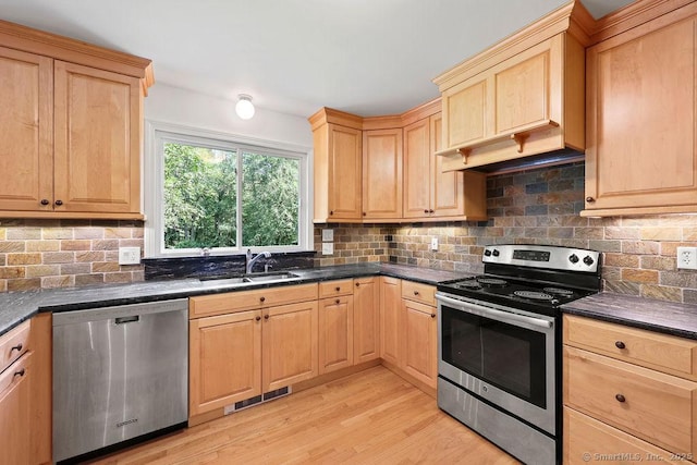 267 Jagger Ln, Hebron, CT 06248 - kitchen with appliances with stainless steel finishes, light brown cabinetry, light wood finished floors, and decorative backsplash