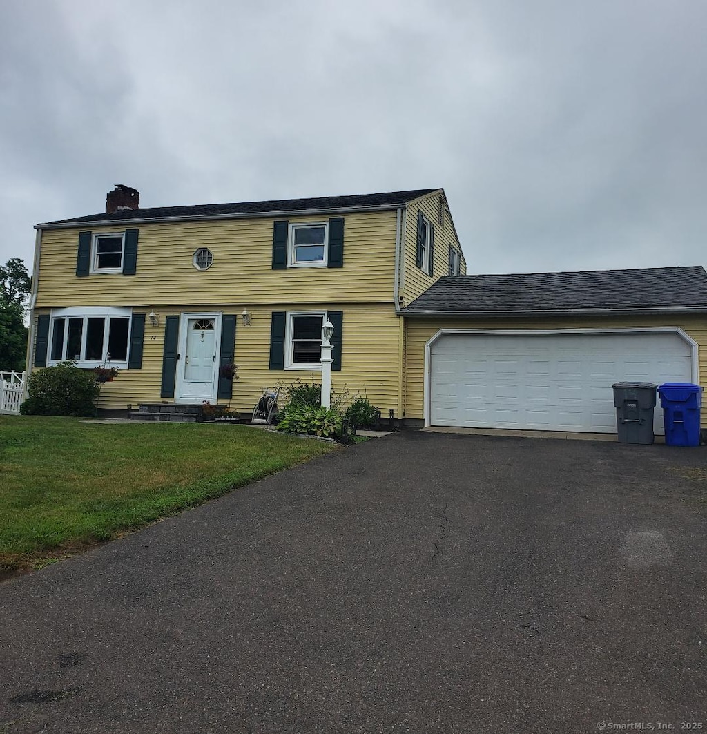 14 Elan St, Enfield, CT 06082 - colonial inspired home with driveway, a chimney, a garage, and a front lawn