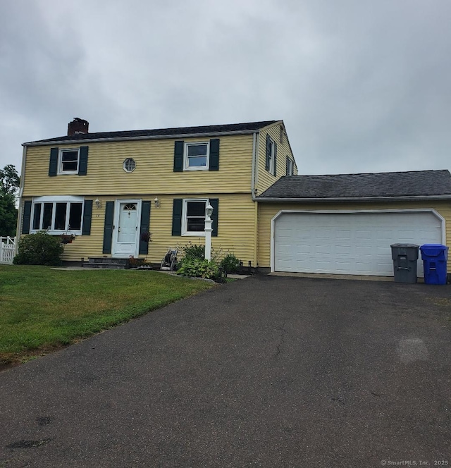 14 Elan St, Enfield, CT 06082 - colonial inspired home with driveway, a chimney, a garage, and a front lawn