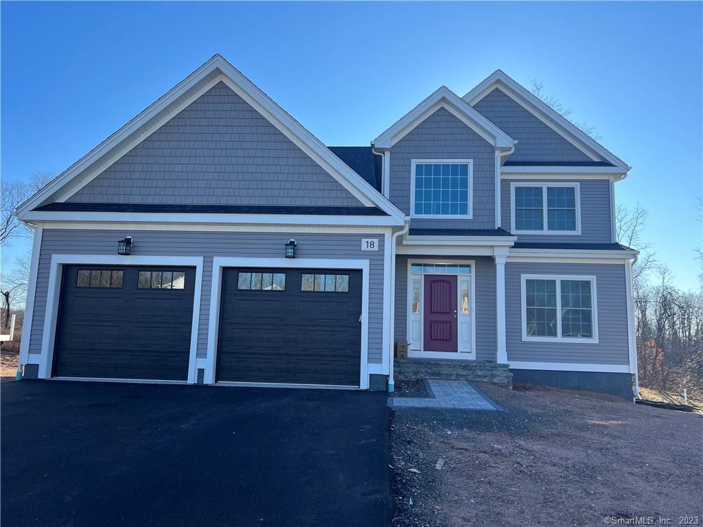 43 Primrose Ln, Cromwell, CT 06416 - craftsman-style home featuring an attached garage and driveway