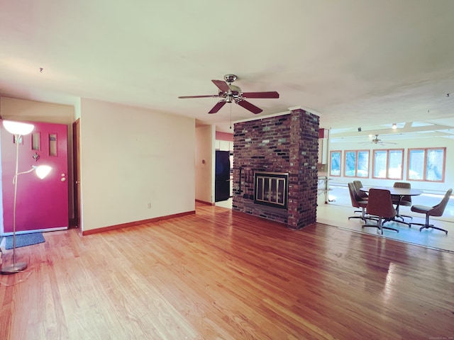 11 Mount Nebo Rd, Newtown, CT 06470 - living area with ceiling fan, light wood finished floors, and a fireplace