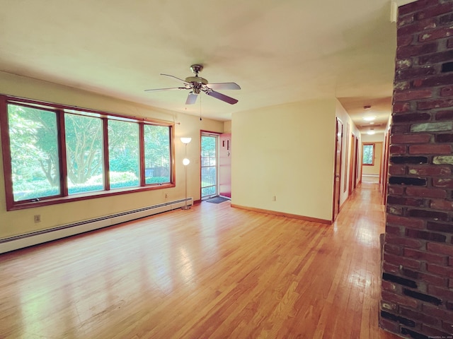 11 Mount Nebo Rd, Newtown, CT 06470 - unfurnished room with light wood finished floors, a baseboard heating unit, and a ceiling fan