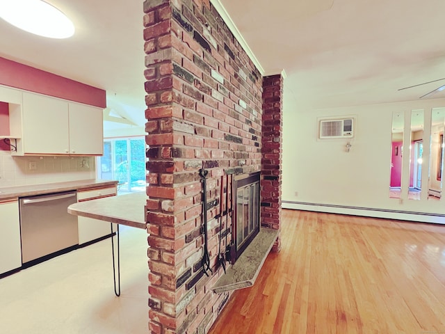 11 Mount Nebo Rd, Newtown, CT 06470 - unfurnished living room featuring a baseboard heating unit, a wall mounted air conditioner, light wood-style flooring, and a fireplace