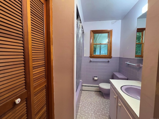 11 Mount Nebo Rd, Newtown, CT 06470 - full bathroom featuring a baseboard heating unit, a closet, vanity, tile patterned floors, and tile walls