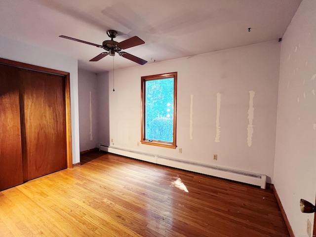 11 Mount Nebo Rd, Newtown, CT 06470 - unfurnished bedroom featuring a baseboard radiator, wood finished floors, a closet, and ceiling fan