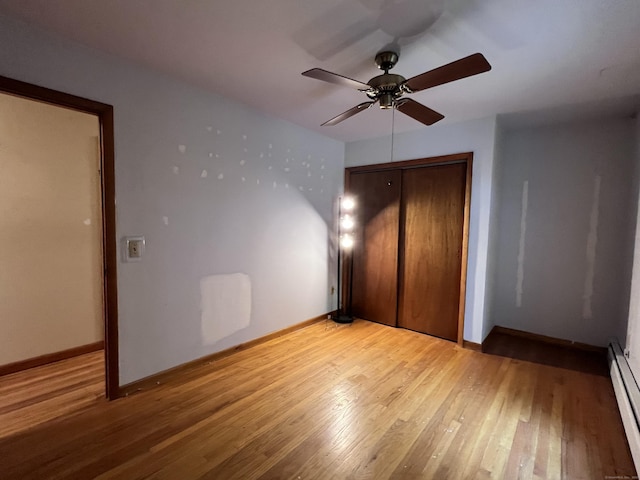 11 Mount Nebo Rd, Newtown, CT 06470 - unfurnished bedroom featuring a baseboard heating unit, a closet, light wood-style floors, and ceiling fan