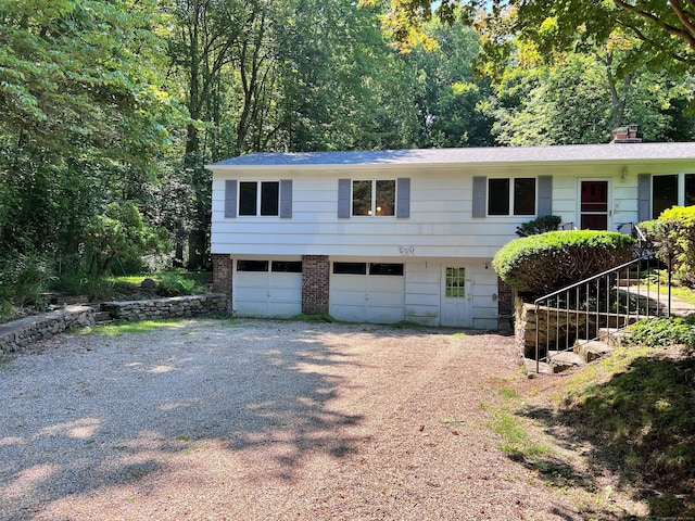 11 Mount Nebo Rd, Newtown, CT 06470 - view of front of home featuring dirt driveway, an attached garage, and stairway