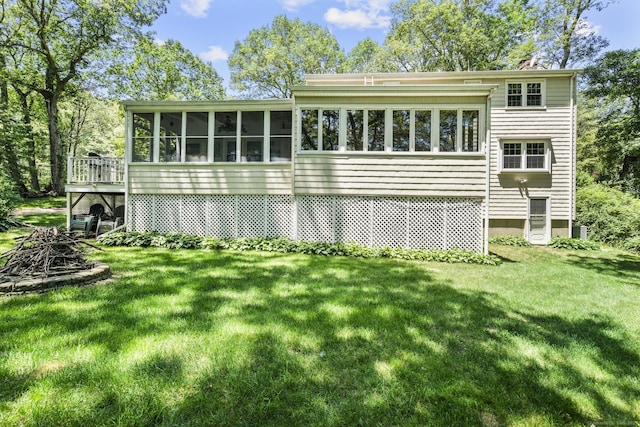 19 Buttercup Ln, Shelton, CT 06484 - rear view of property featuring a sunroom, a lawn, and a chimney