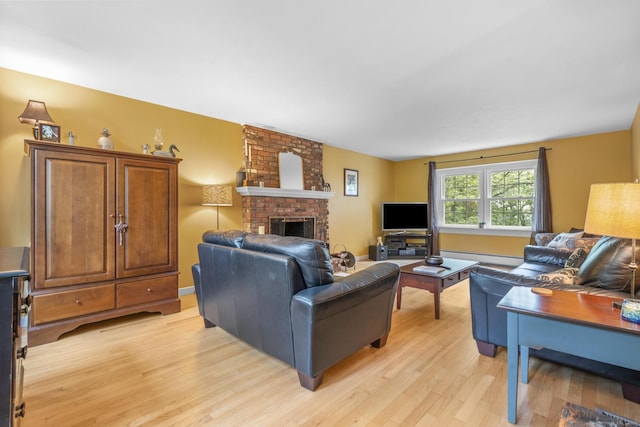 19 Buttercup Ln, Shelton, CT 06484 - living room featuring light wood-style flooring, a fireplace, and baseboard heating