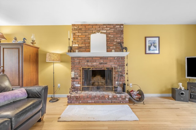 19 Buttercup Ln, Shelton, CT 06484 - living area with wood finished floors and a fireplace