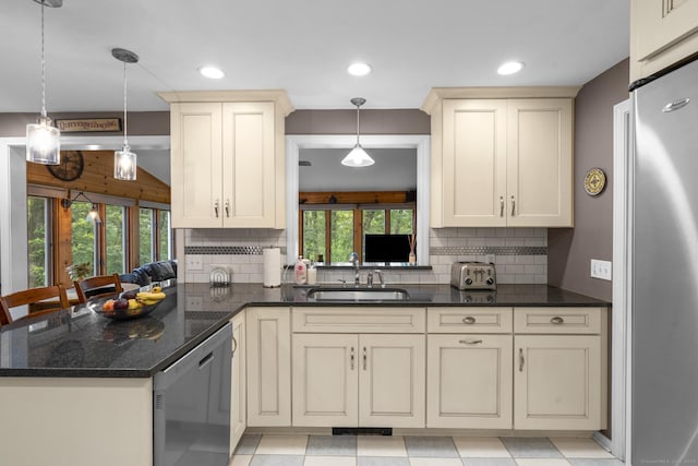 19 Buttercup Ln, Shelton, CT 06484 - kitchen featuring appliances with stainless steel finishes, cream cabinets, decorative backsplash, and recessed lighting