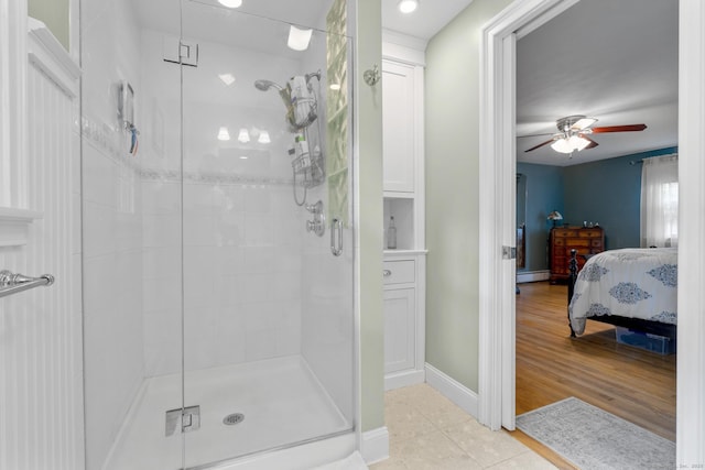 19 Buttercup Ln, Shelton, CT 06484 - ensuite bathroom featuring a stall shower, tile patterned flooring, ceiling fan, and a baseboard radiator