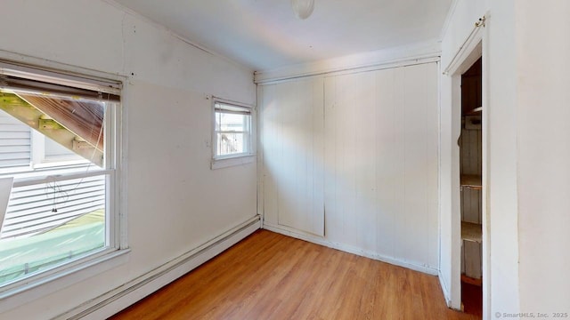 36 Merwin Ave, Milford, CT 06460 - unfurnished bedroom featuring a baseboard radiator and light wood-type flooring