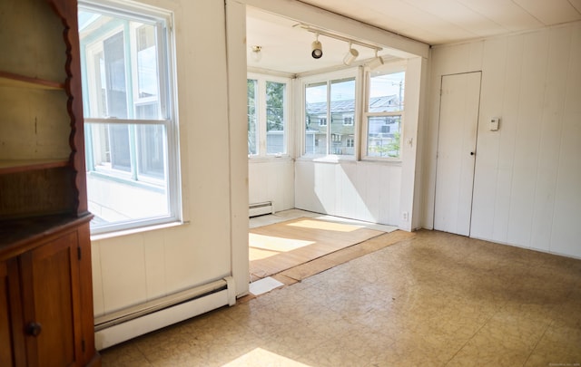 36 Merwin Ave, Milford, CT 06460 - unfurnished dining area featuring baseboard heating, tile patterned floors, plenty of natural light, and wood walls