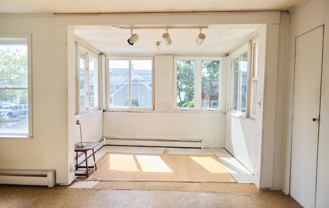 36 Merwin Ave, Milford, CT 06460 - unfurnished sunroom featuring a baseboard heating unit and rail lighting