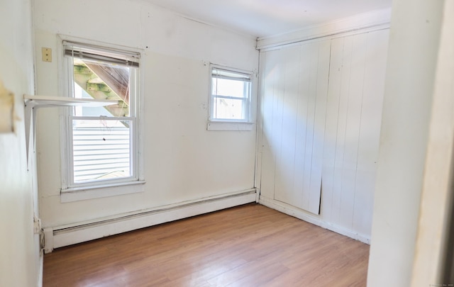 36 Merwin Ave, Milford, CT 06460 - unfurnished room featuring a baseboard radiator and light wood-style flooring