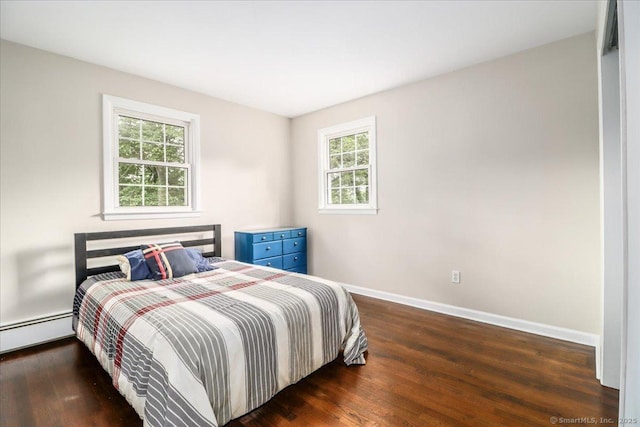 17 Robinhood Rd, Danbury, CT 06811 - bedroom with wood finished floors, multiple windows, and a baseboard heating unit