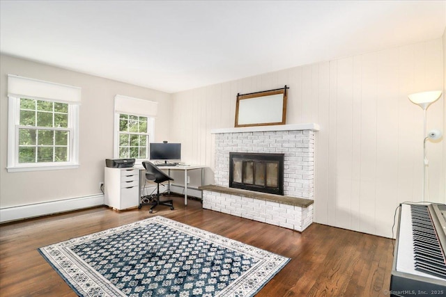 17 Robinhood Rd, Danbury, CT 06811 - home office featuring a baseboard radiator, wood finished floors, a brick fireplace, and heating unit