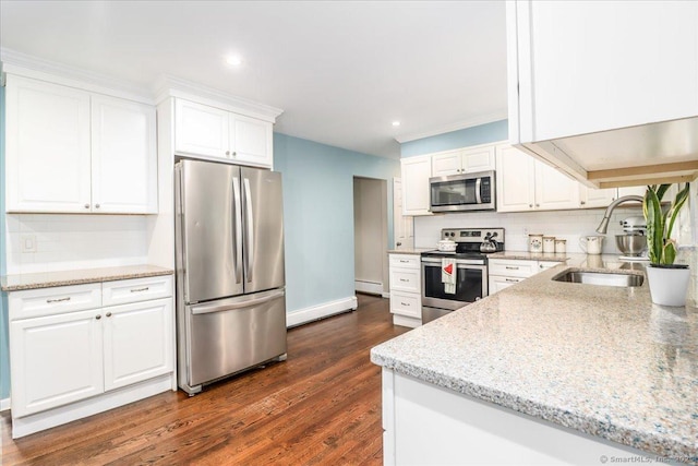 17 Robinhood Rd, Danbury, CT 06811 - kitchen featuring stainless steel appliances, a baseboard radiator, decorative backsplash, white cabinets, and recessed lighting