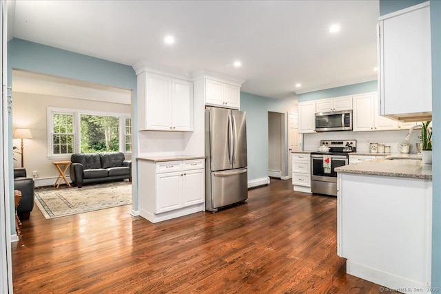 17 Robinhood Rd, Danbury, CT 06811 - kitchen featuring stainless steel appliances, baseboard heating, white cabinets, dark wood-type flooring, and recessed lighting
