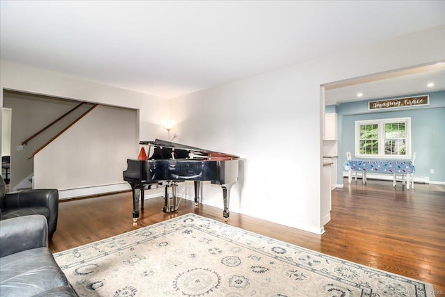 17 Robinhood Rd, Danbury, CT 06811 - sitting room with wood finished floors, a baseboard heating unit, and stairs