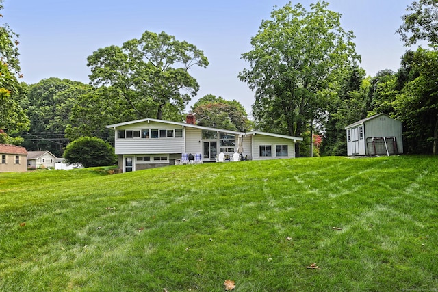 23 Briarwood Dr, Old Saybrook, CT 06475 - rear view of house with a chimney and a yard