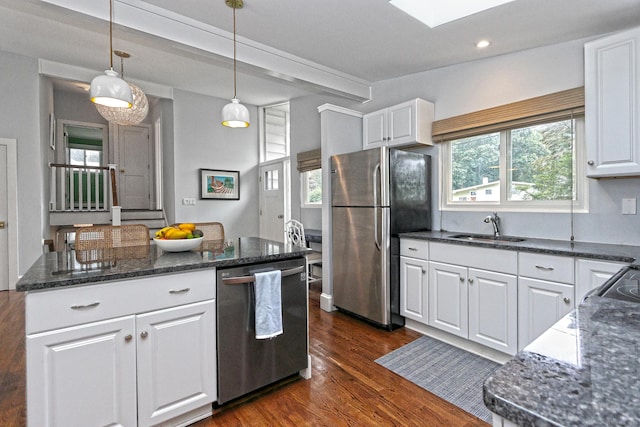 23 Briarwood Dr, Old Saybrook, CT 06475 - kitchen featuring appliances with stainless steel finishes, white cabinets, healthy amount of natural light, dark wood-type flooring, and recessed lighting