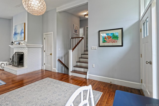 23 Briarwood Dr, Old Saybrook, CT 06475 - living area featuring a fireplace, wood finished floors, and stairway