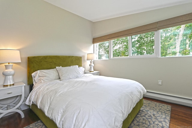 23 Briarwood Dr, Old Saybrook, CT 06475 - bedroom featuring a baseboard heating unit and dark wood finished floors