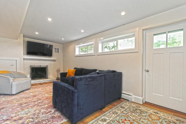 23 Briarwood Dr, Old Saybrook, CT 06475 - living room featuring a baseboard radiator, wood finished floors, recessed lighting, and a fireplace
