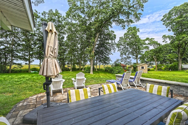 23 Briarwood Dr, Old Saybrook, CT 06475 - wooden terrace with a lawn, outdoor dining area, a patio area, and a storage shed