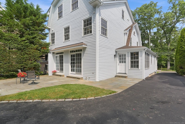 36 Hendrie Ave, Greenwich, CT 06878 - back of property with a patio