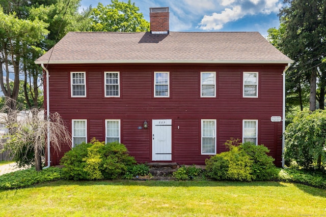 889 S Main St, Southington, CT 06479 - colonial house featuring a front yard, a chimney, and roof with shingles
