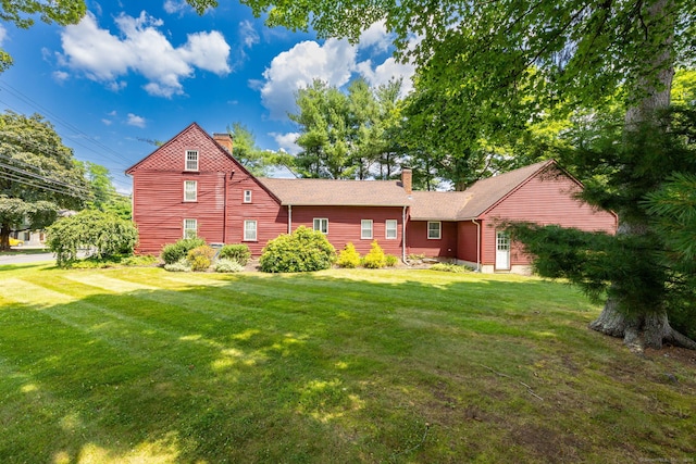 889 S Main St, Southington, CT 06479 - rear view of property with a chimney, a lawn, and roof with shingles