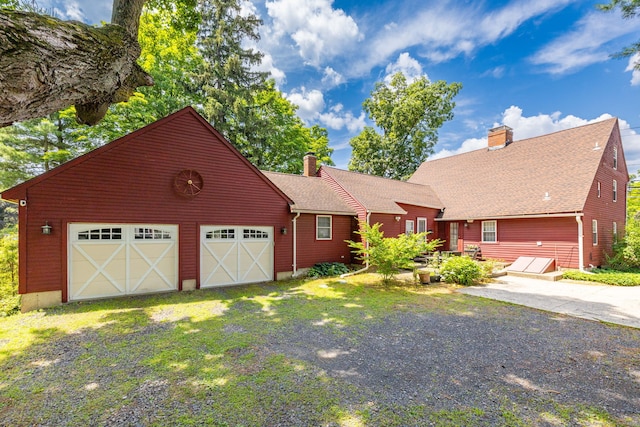 889 S Main St, Southington, CT 06479 - rustic home with a chimney, a garage, driveway, and a shingled roof