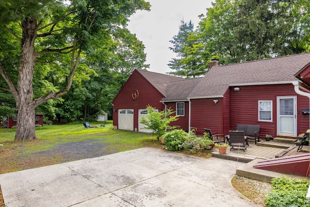 889 S Main St, Southington, CT 06479 - back of house featuring a deck, a chimney, a shingled roof, and a yard