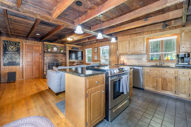889 S Main St, Southington, CT 06479 - kitchen with a wood ceiling with exposed beams, appliances with stainless steel finishes, wooden walls, a kitchen island, and healthy amount of natural light
